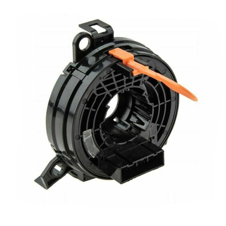 Black clock spring coil with orange safety latch and circular housing