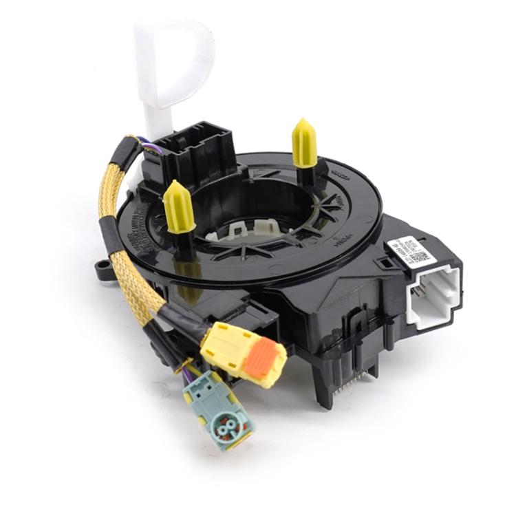 Steering clock spring coil module with wiring plugs and connector housing