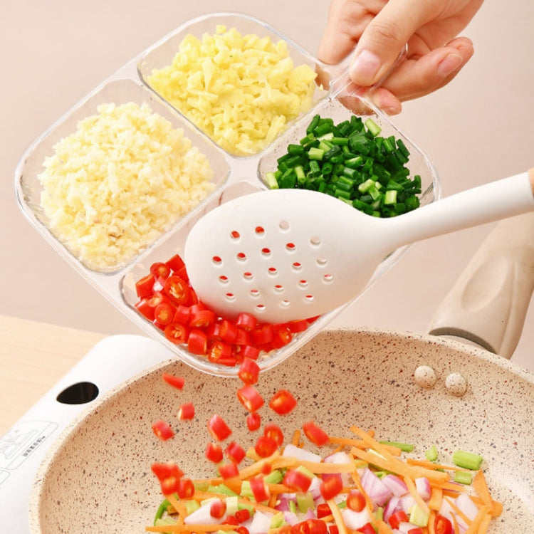 Clear quad-compartment tray filled with chopped vegetables and grated cheese