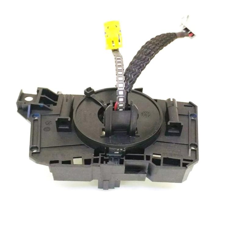 Clock spring coil assembly with yellow connector block and braided ribbon