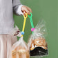 Green and yellow sealing tape clips holding plastic bags of food