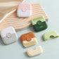Set of 2-in-1 hair clipper combs in pink, green, orange, and white