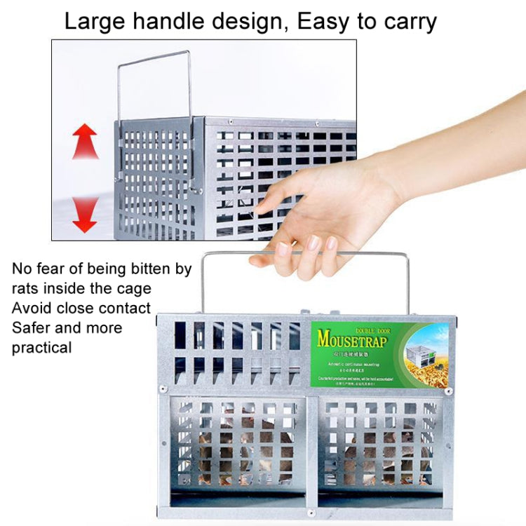 Large metal mouse trap cage with hinged handle, shown held by a hand