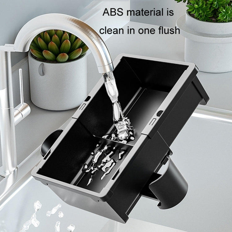Car armrest storage box with open bins shown with water splash cleaning