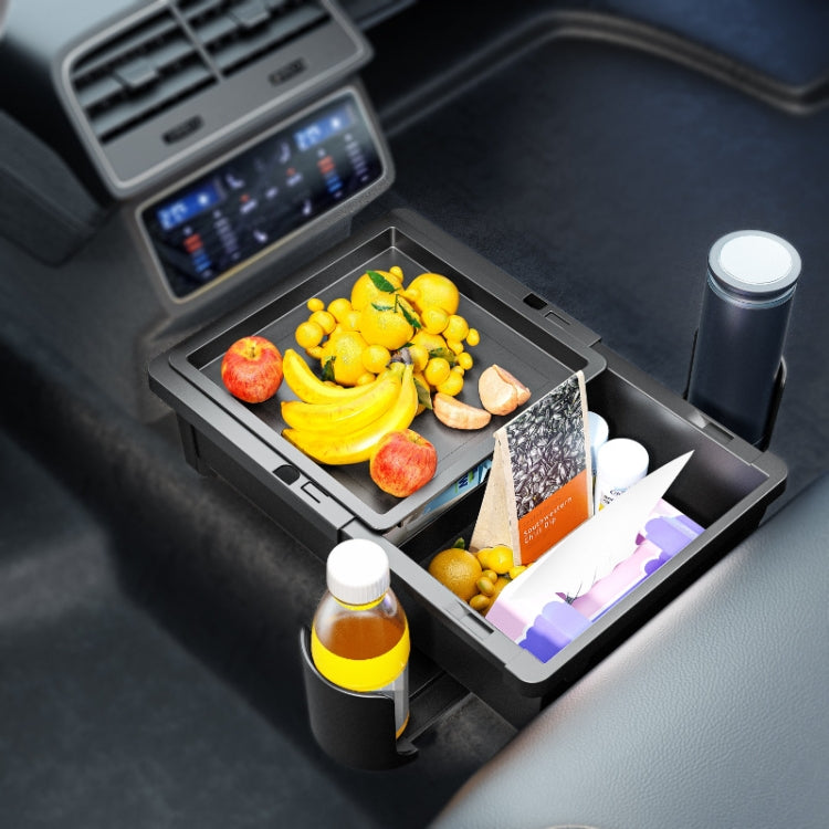 Car armrest storage box with open bin holding snacks and drink bottles