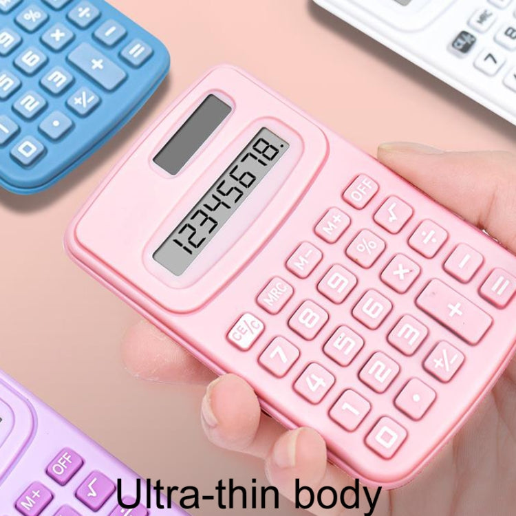 Pink ultra-thin calculator in hand with LCD display and button keypad