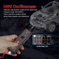 Hand holding mini circuit tester oscilloscope with lit display and connected red lead