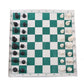 Foldable portable chess set board with scattered black and white chess pieces