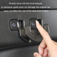 Black trunk seat button hook attached to trunk keypad, finger pressing into place.