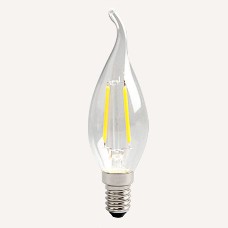Clear teardrop LED bulb with warm yellow filament glow and E14 screw base