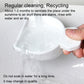 Hand holding a white drying scoop over a wet surface