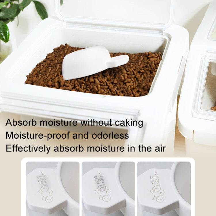 White moisture-absorbing drying scoop in a bin of brown dry granules