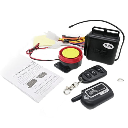 Motorcycle anti-theft alarm main unit with yellow button, speaker, and dual key fobs