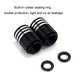 Pair of black tire valve caps with white skulls plus rubber sealing rings