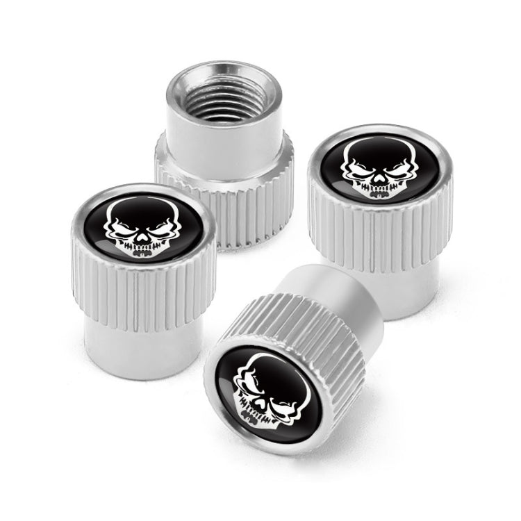 Set of 4 silver aluminum valve caps with black skull emblem and ribbed grip