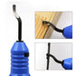 Blue edge trimmer with curved scraper blade contacting a wood board edge