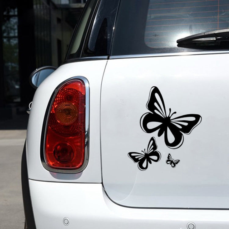 Black butterfly fuel cap decal sticker set on a light car surface
