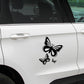 Black butterfly decal sticker set on a light car door surface