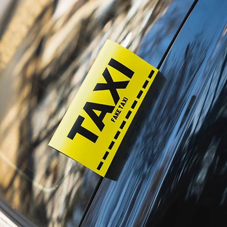 Yellow TAXI car decal sticker with black 'FAKE TAXI' on car window