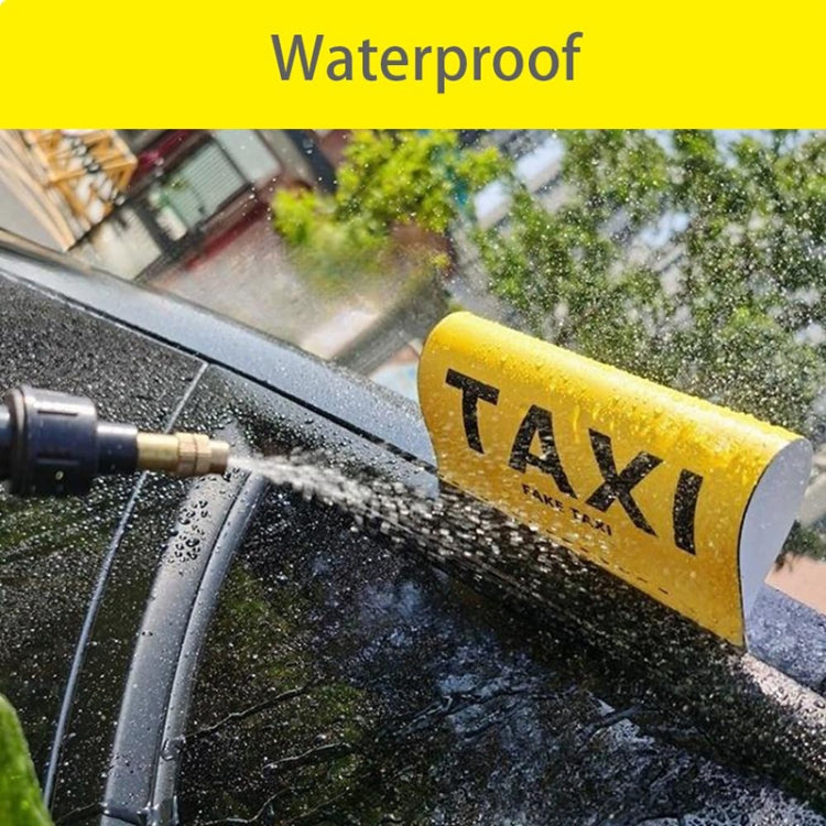 Yellow TAXI car decal sticker with black 'FAKE TAXI' on car windshield