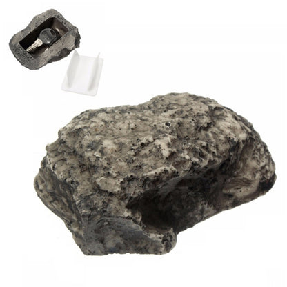 Rock-style key hiding box shaped like a pine nut, with open slot and small key