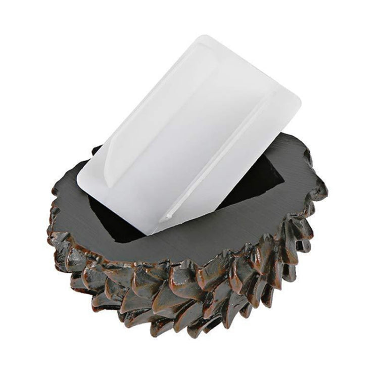Pinecone-look key hiding safe with gray base and white tray insert