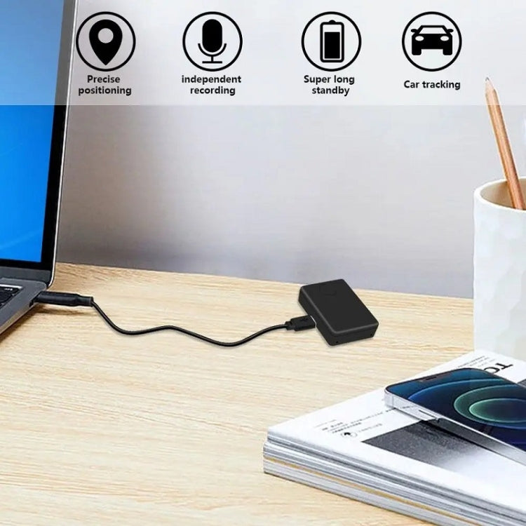Black locator sensor with connected charging cable on a desk