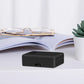 Black compact locator sensor with front USB port on tabletop