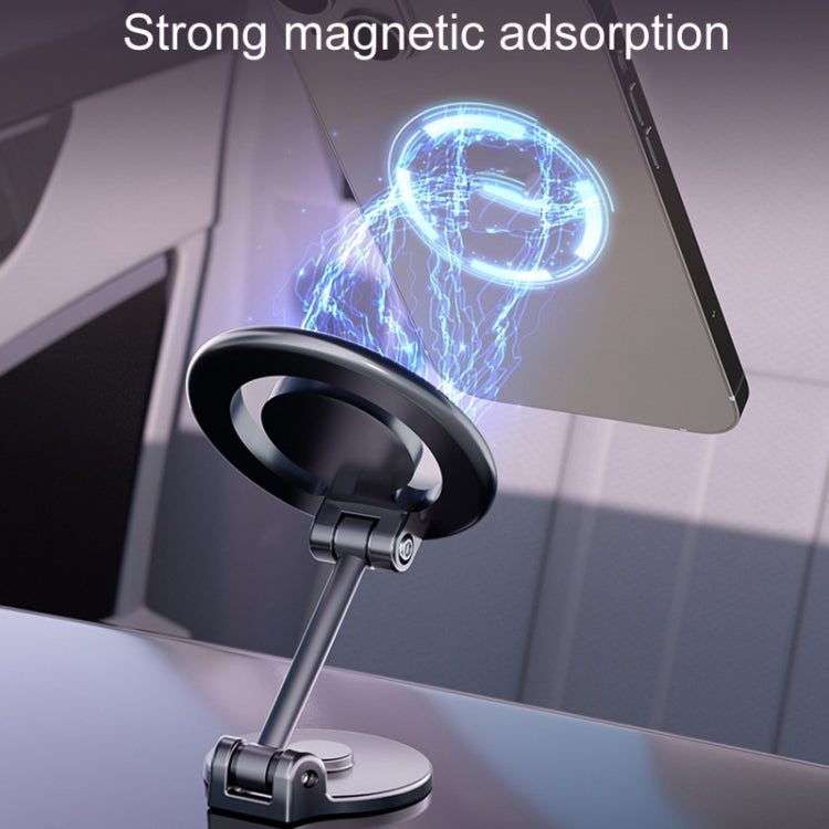 Black magnetic car phone holder attached to dashboard near phone screen