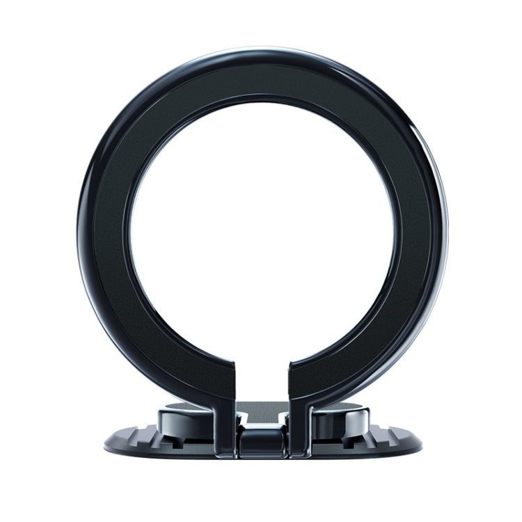 Black magnetic car phone holder with circular base and clamp arms for dashboard use