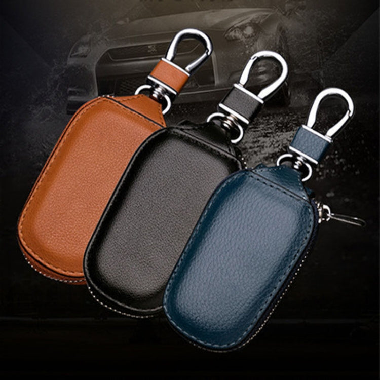 Set of leather key pouches in black, blue, and brown with key rings