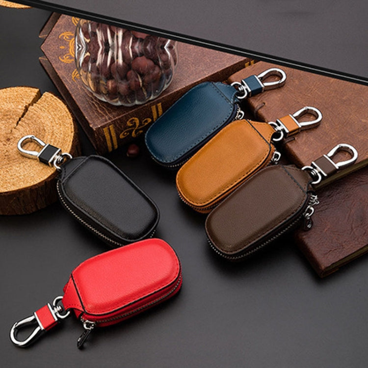 Leather key storage bag with zipper and metal key rings, blue and brown pouches