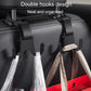 Double hooks on black car seat holding clear plastic bags with straps