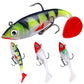 Green-and-black swimbait lure with red tail, oval eye, and treble hook