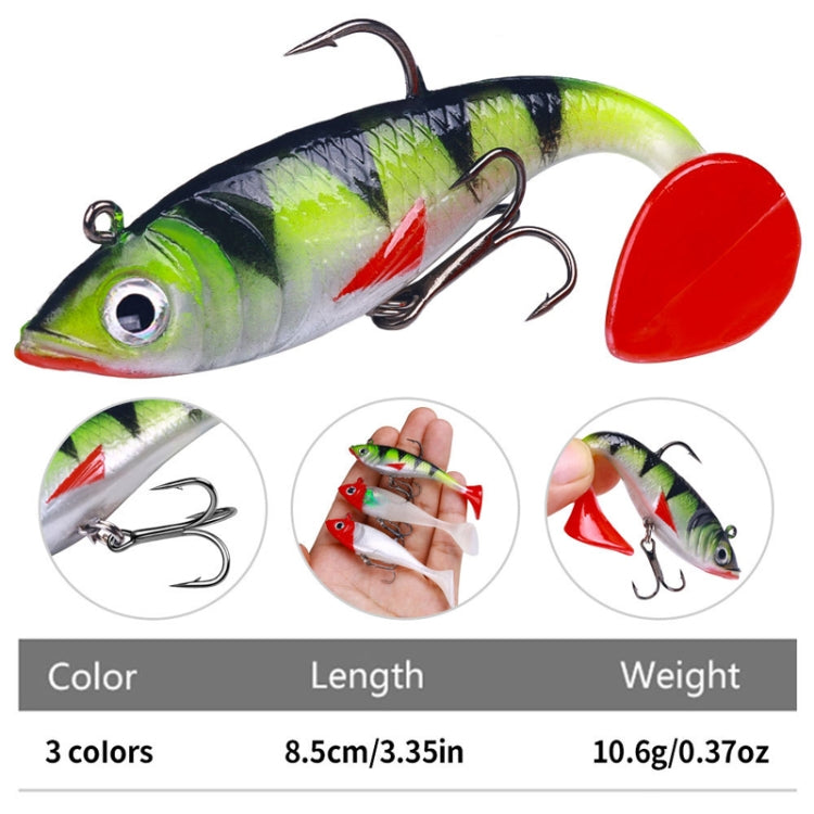Green swimbait lure with red tail and treble hook, shown with pack details