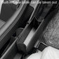 Black folding car seatback storage bin near seat seams with removable base rails