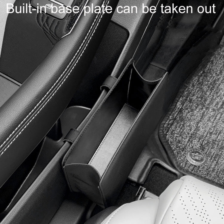 Black folding car seatback storage bin near seat seams with removable base rails