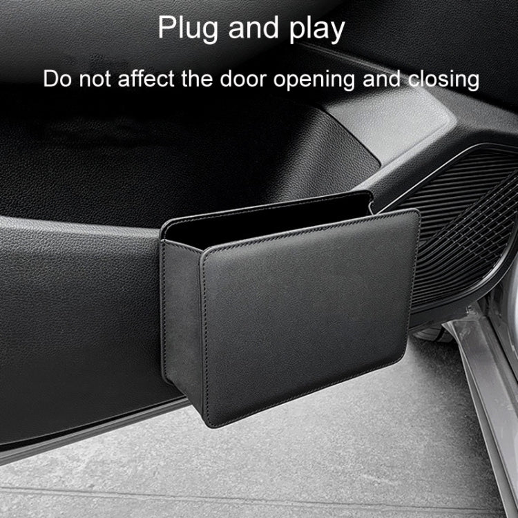Black folding car seatback trash can hanging beside the front seat for storage