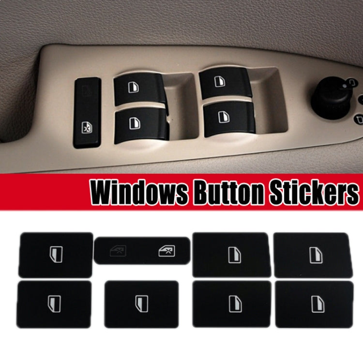 Window switch button repair stickers installed on a car door panel, black with white icons