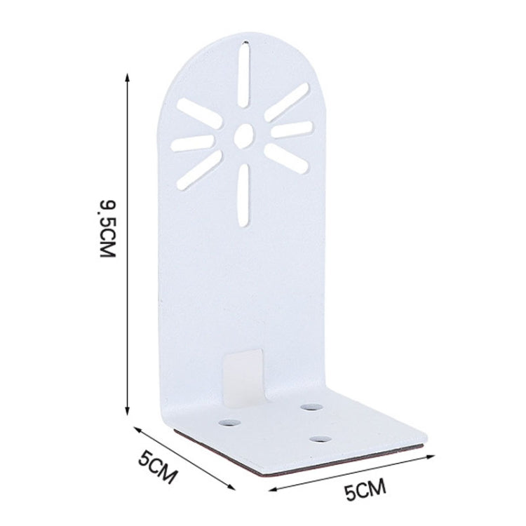 White metal camera wall bracket with sunburst cutouts and corner mounting holes