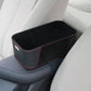 Black car armrest storage box with red trim and suede-style surface