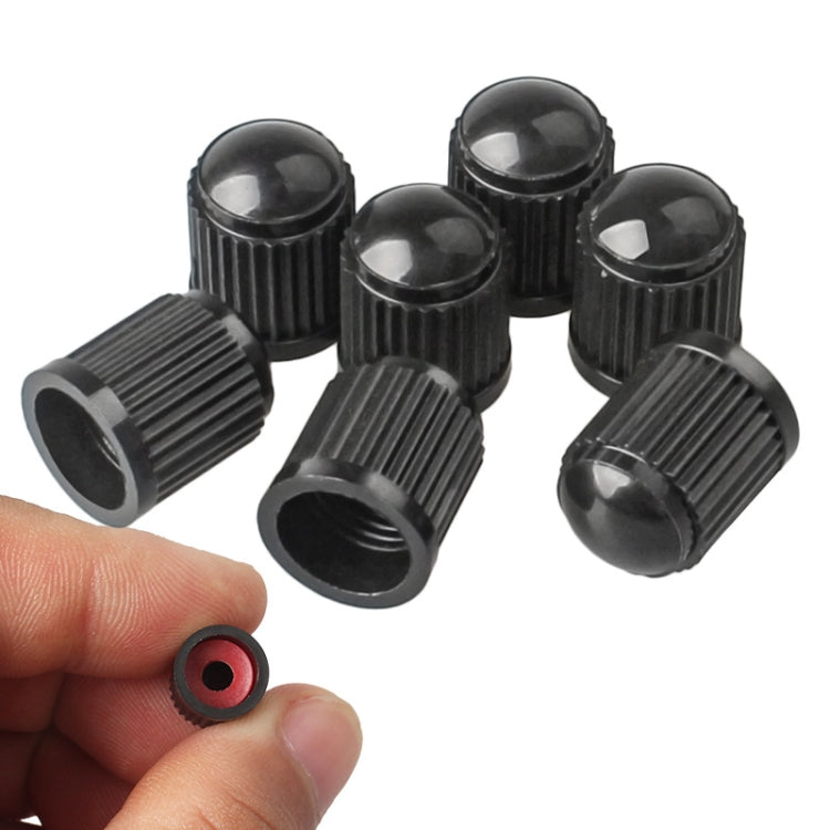 Black ribbed plastic tire valve caps with rubber insert, set of 30