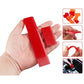 Hand holding two red soft rubber car glass scraper blades