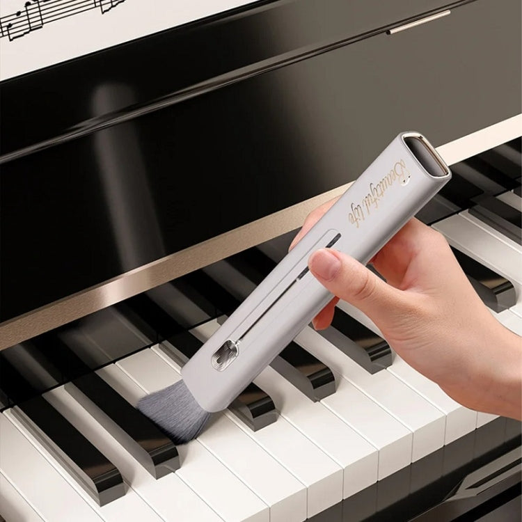 White air vent cleaning brush with soft gray bristles for tight gaps