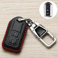 Black Toyota key fob cover with red stitching and metal clip, back side with icons