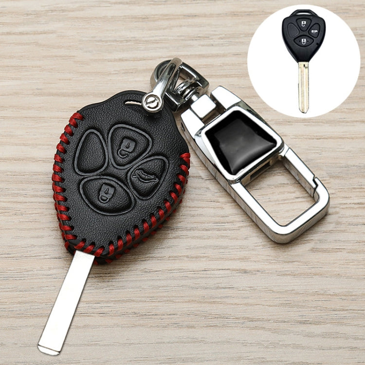Black Toyota key fob cover with red stitching, metal keychain clip and key blade