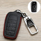 Black car key fob cover with red stitching, metal buckle and key ring