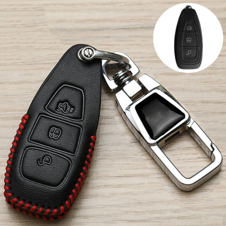 Black key fob cover with red stitching and embossed icon panel, chrome key holder