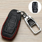 Black car key cover with red stitched border, embossed controls, metal keyring on holder