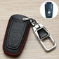 Black leather-style car key case with red stitching, embossed panel, chrome keyring holder